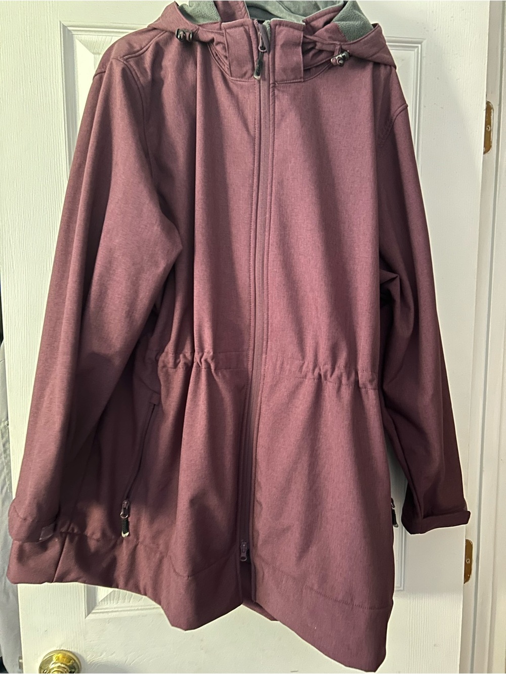 Maroon rain jacket with adjustable waist